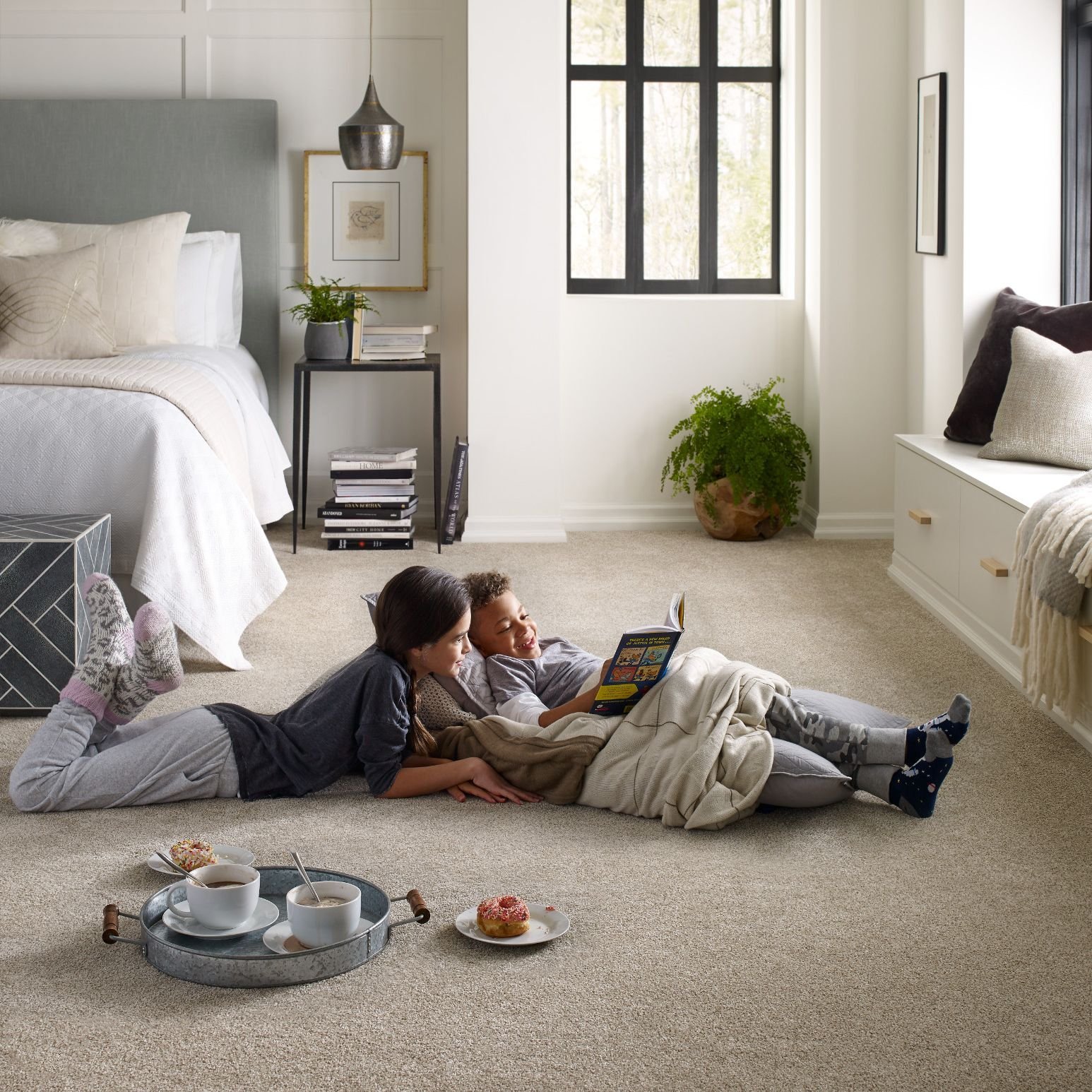 kids reading on bedroom floor from Er Walker Flooring Specialists in Fayetteville, GA